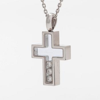Chopard, an 18K whitegold 'Happy Diamonds" cross necklace set with diamonds.