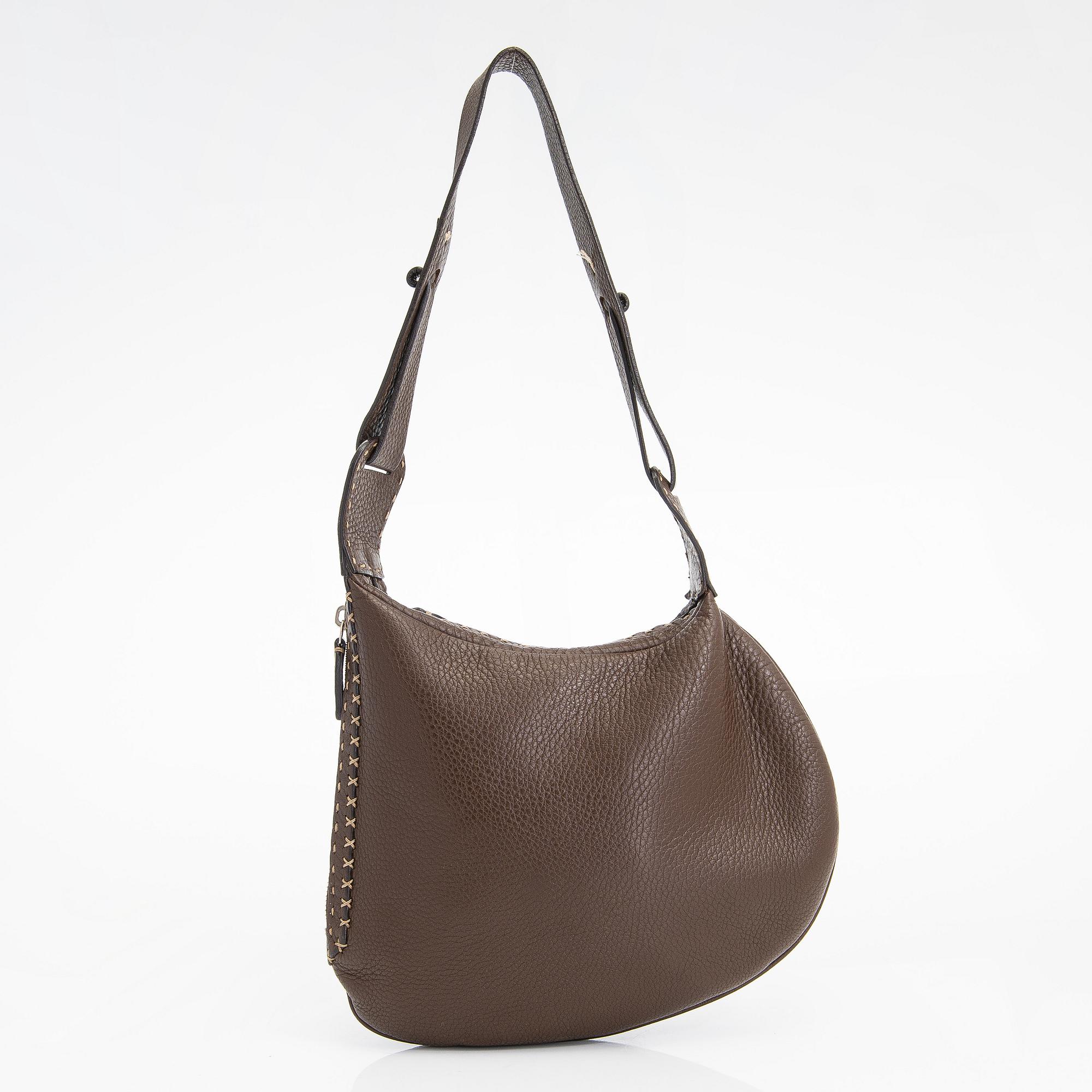 Fendi, a brown leather bag.
