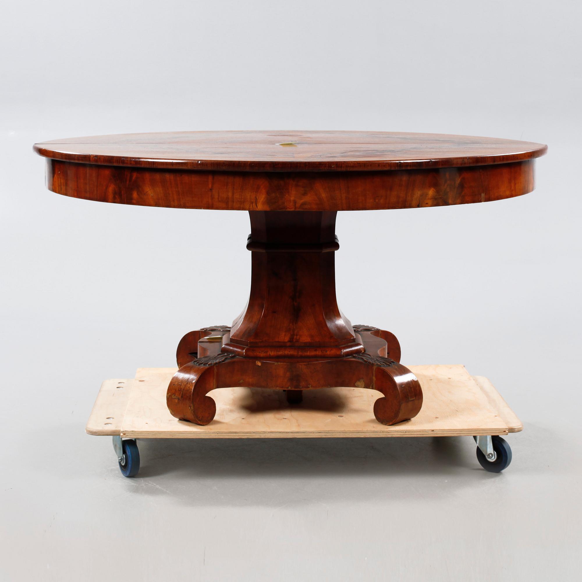 A late 19th century table with two extension leaves.