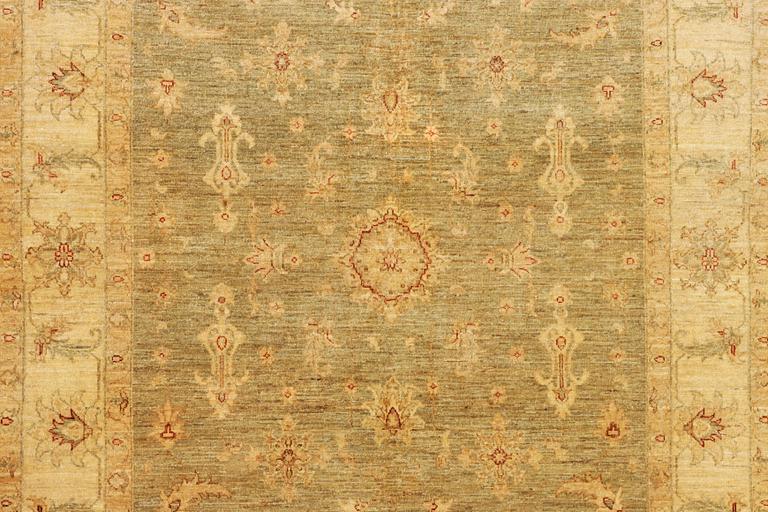 An Ushak rug, c. 244 x 167 cm.