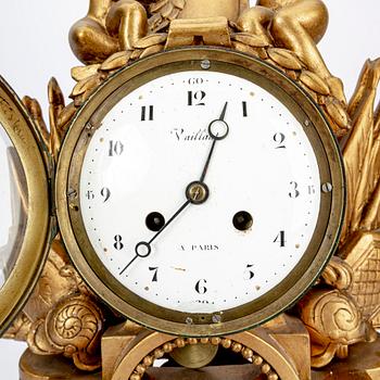 An Empire gilded table clock marked Vaillant Paris.