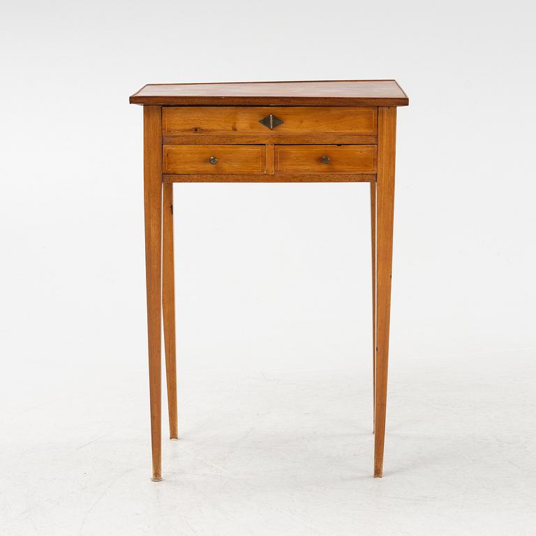 A mahogany veneered table with drawers. Early 19th Century.