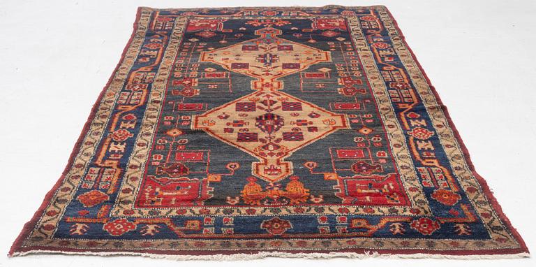 An Oriental rug, c. 282 x 154 cm.
