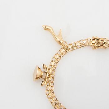 Bracelet 18K gold Bismarck link with charms.