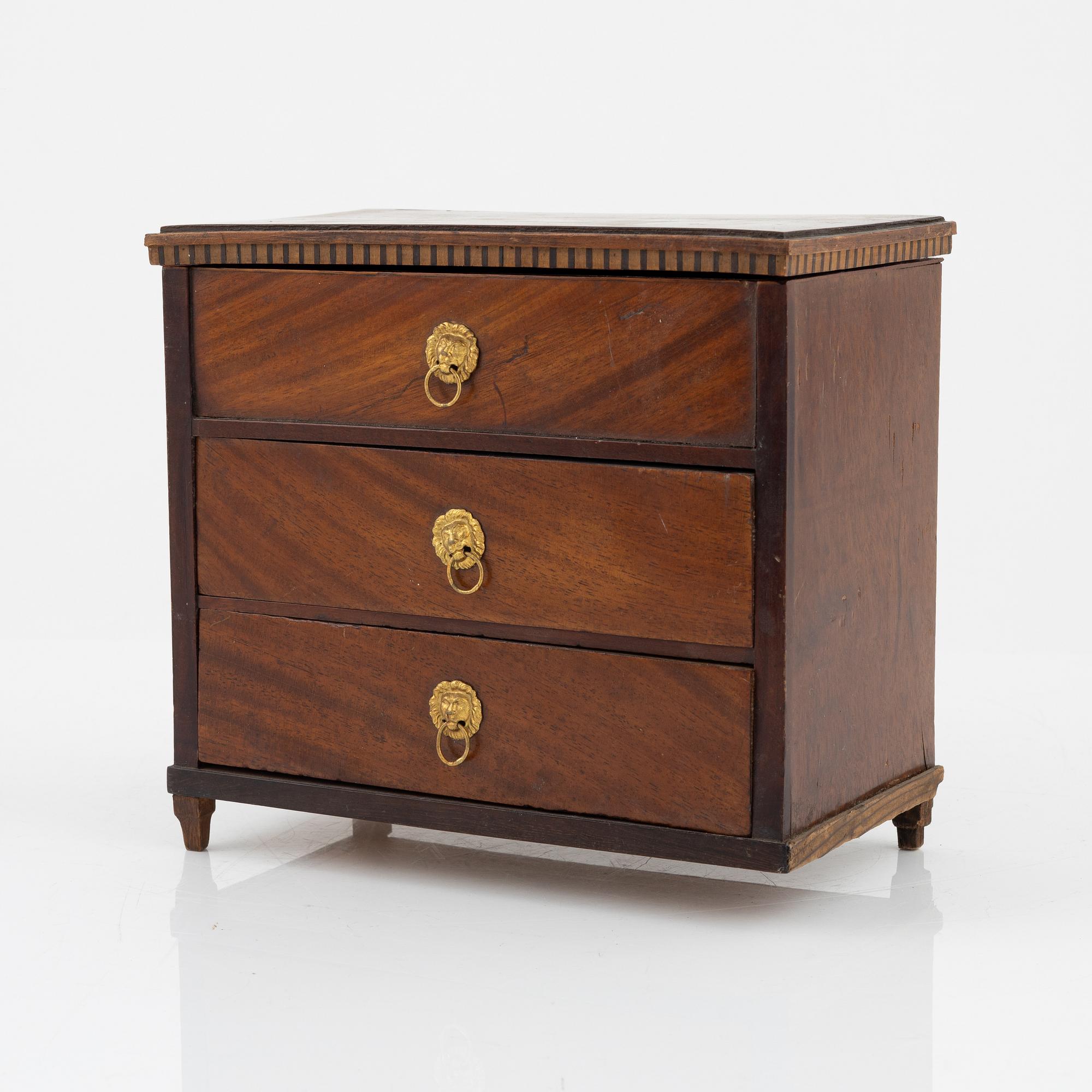 An Empire mahogany miniature commode, 19th Century.