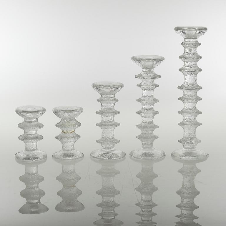 Five glass candlesticks by Timo Sarpaneva for Iittala, model "Festivo", second half of the 20th century.