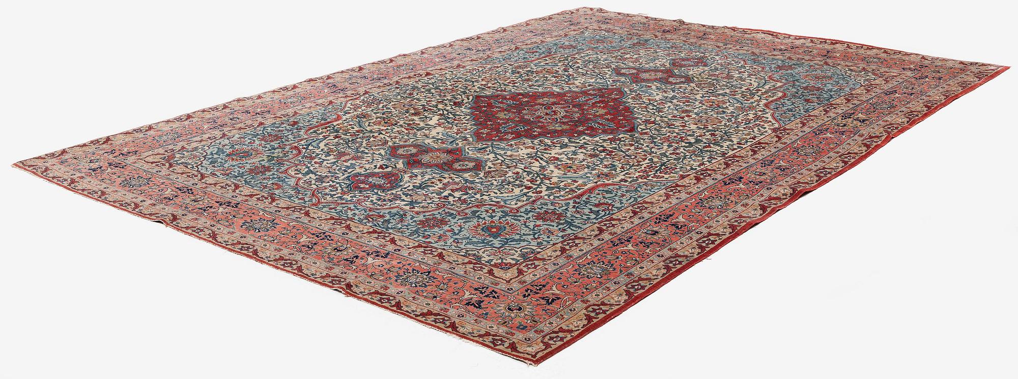 A semi-antique Qum carpet. Central Persia, c. 345 x 258 cm.