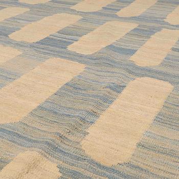A flatweave rug, 285 x 222 cm.