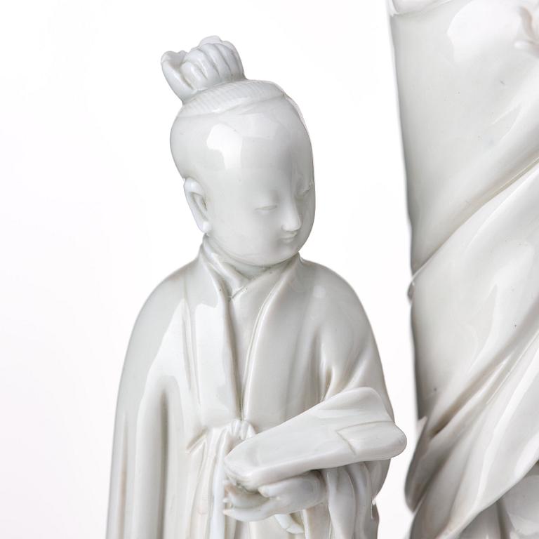 A blanc de chine figure of Guanyin and a servant, Qing dynasty, 19th Century.