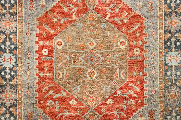 An oriental carpet with Mamluk design, c. 359 x 281 cm.