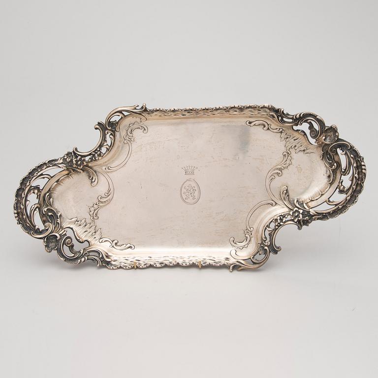 A German silver tray, mark of M.H. Wilkens & Söhne, Austrian import mark, retailer mark of V. Mayers Söhne, 1891-1901.