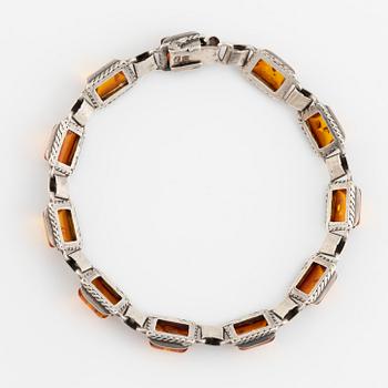 Silver and amber bracelet and earrings.