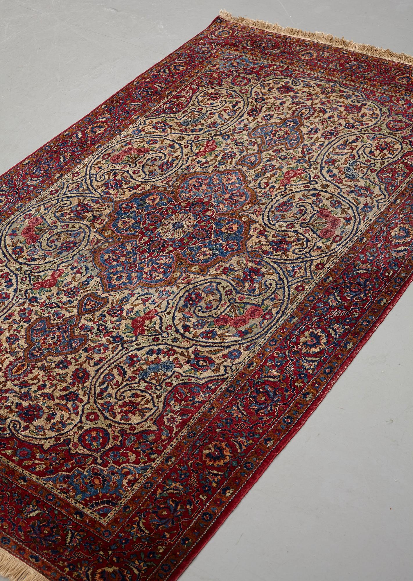 Matto, a semi-antique silk Kashan, ca 212,5-214,5 x 134,5-135,5 cm.
