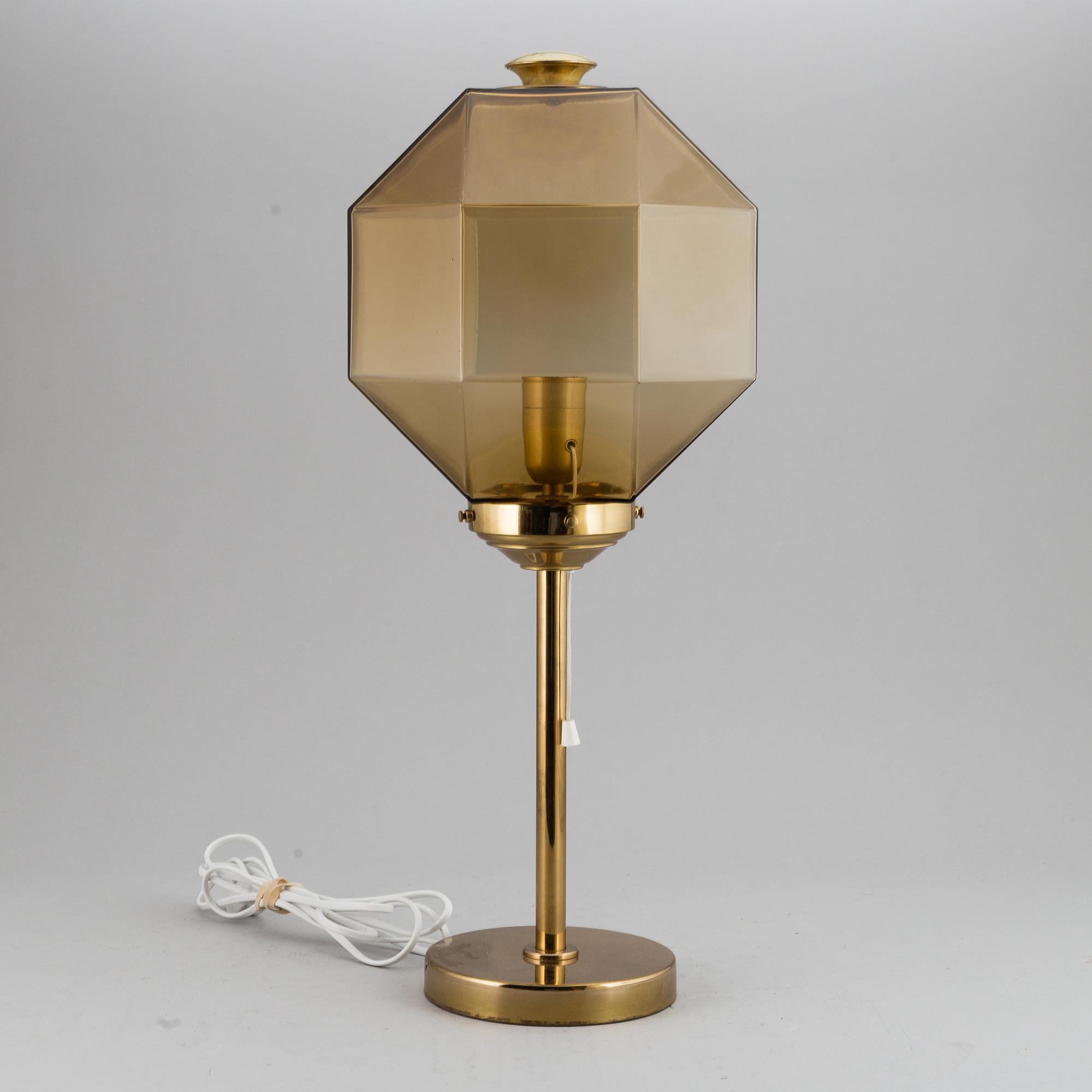 A decond half of the 20th Century brass and glass table light from Bergboms.