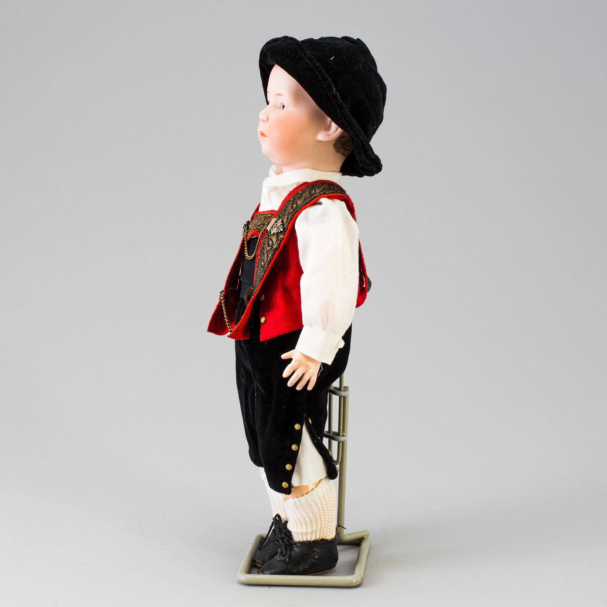 A bisque headed boy doll by Heubach, Germany, 1910s.