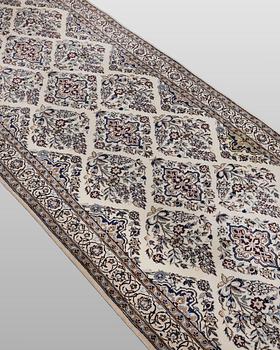 A Nain part silk carpet, 408 x 98 cm.
