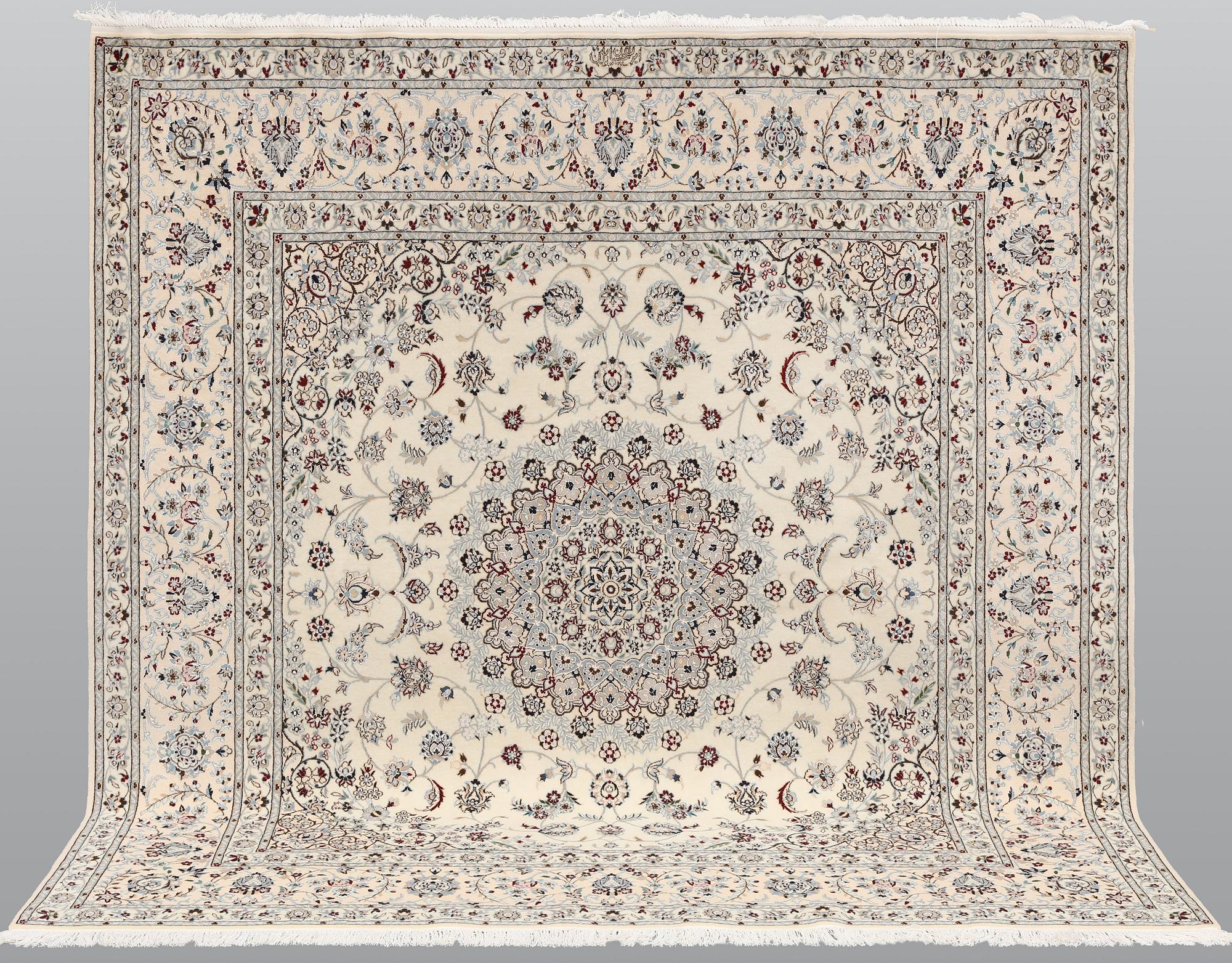 A Nain part silk carpet, c. 207 x 208 cm.