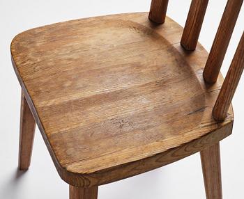Axel Einar Hjorth, a set of seven stained pine "Utö" chairs, Nordiska Kompaniet, Sweden, 1930s.