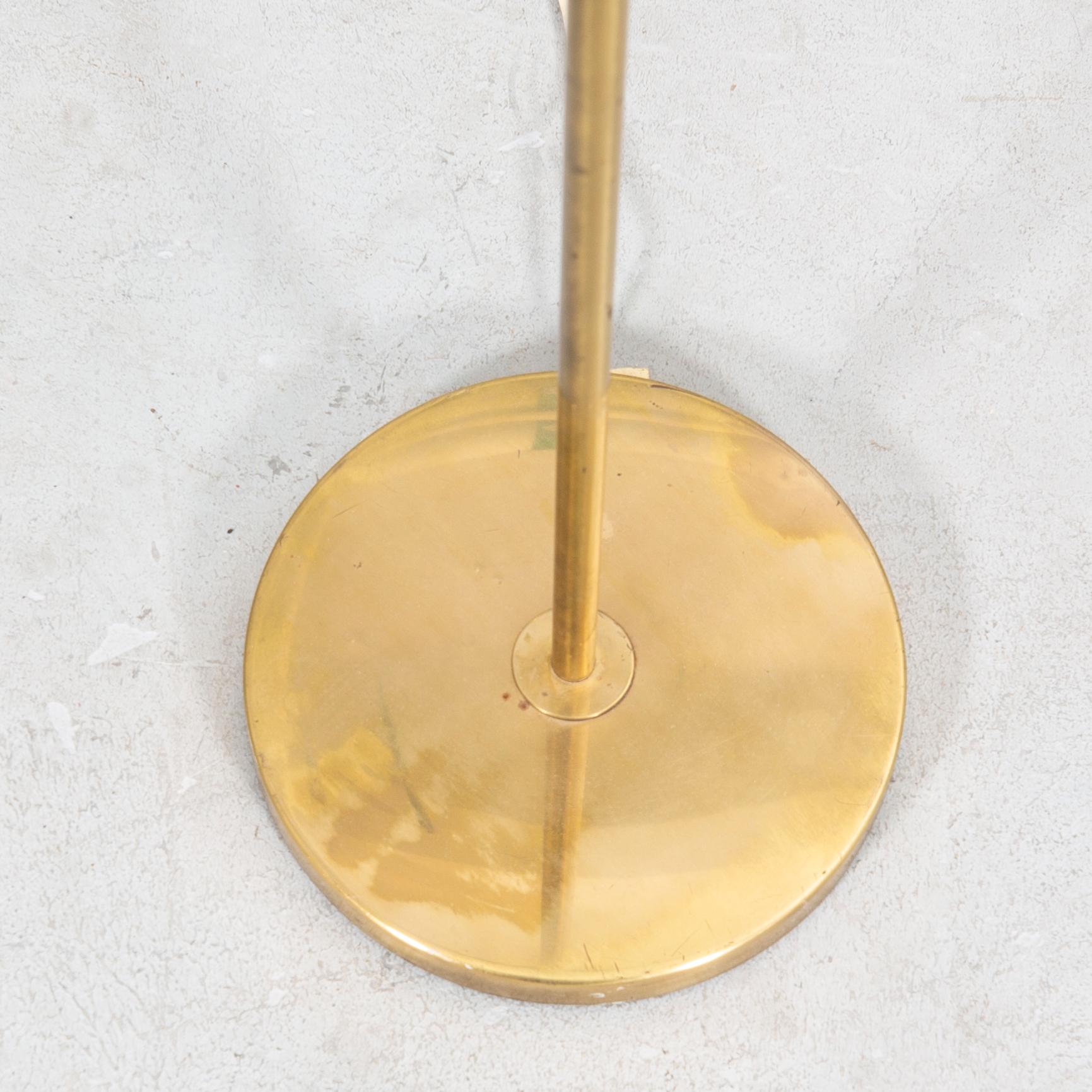 An NK 1960s brass floor lamp.