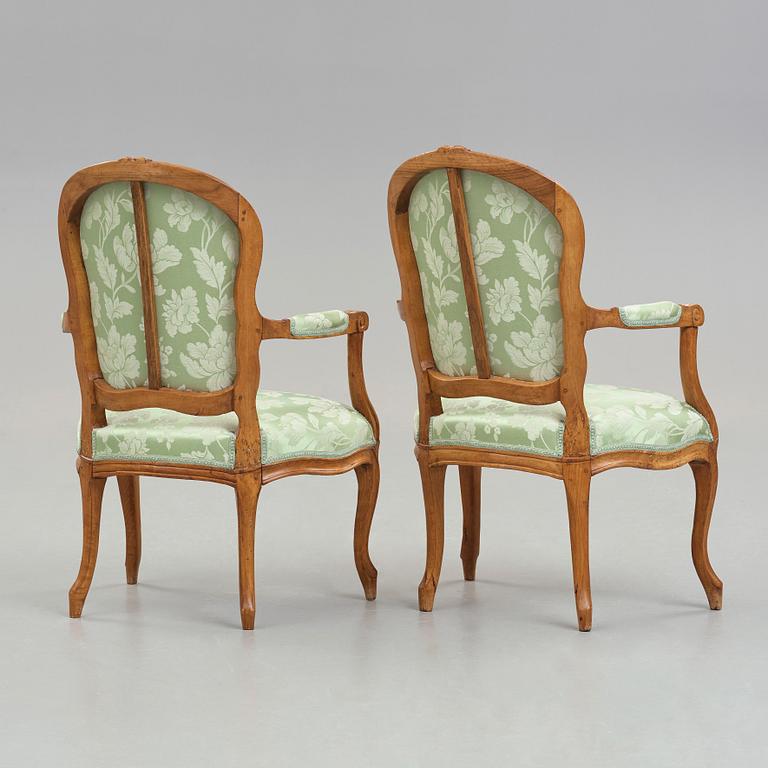 Two matched Louis XV 18th century armchairs.