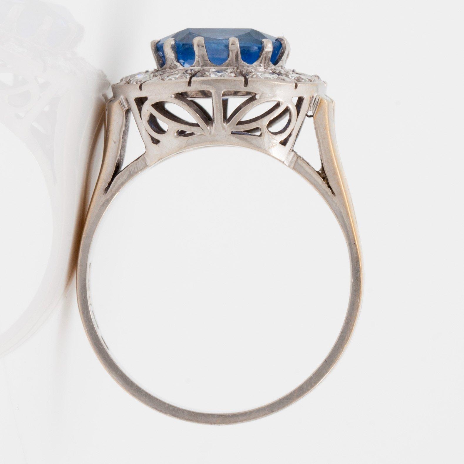 A 3.39 ct untreated sapphire and brilliant cut diamond ring. Total carat weight of diamonds 0.55 ct.