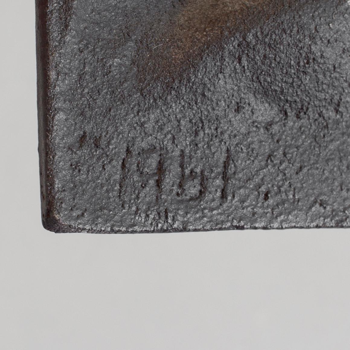 MICHAEL SCHILKIN, a cast iron plaque "See no evil, hear no evil, say no evil", signed and dated Högfors 1961.