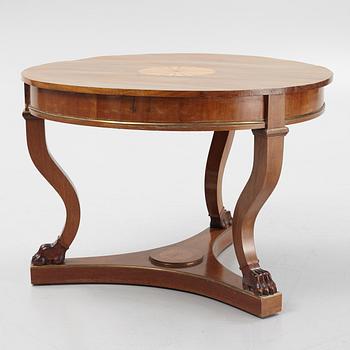 A mahogany veneered Empire style table, first half the 20th Century.