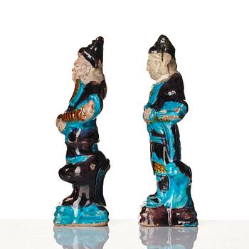 A pair of turquoise and purple glazed figures of guardsmen, Ming dynasty (1368-1644).