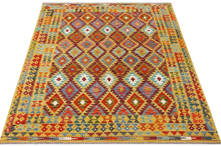 A Kilim rug, c. 240 x 181 cm.