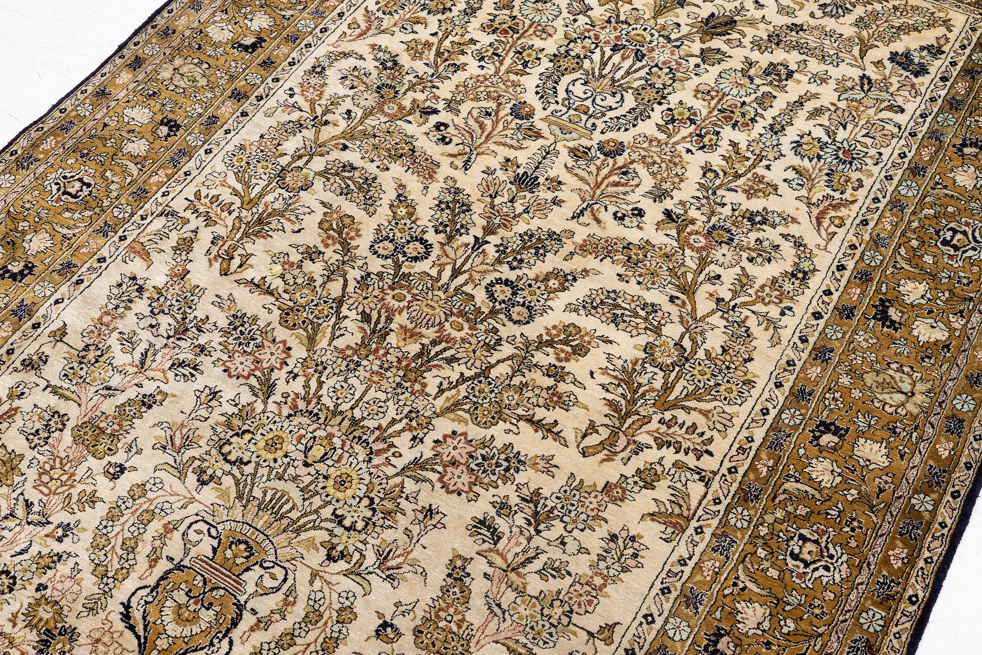 A Ghom, silk rug, c. 215 x 140 cm.