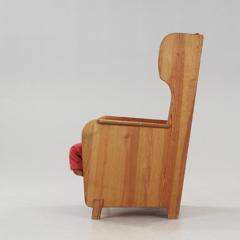 Axel Einar Hjorth, a 'Lovö' stained pine armchair, Nordiska Kompaniet, Sweden 1930's.