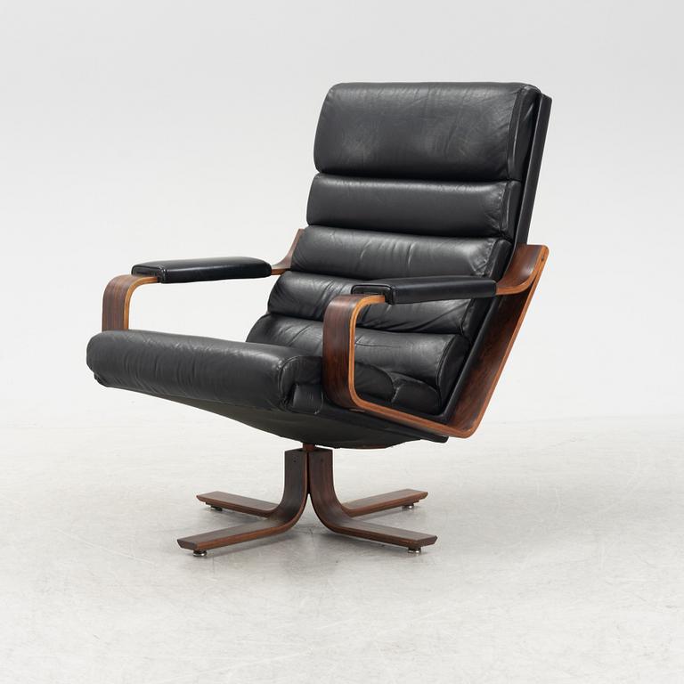 Karl-Erik Ekselius, a rosewood swivel armchair from JOC Vetlanda, 1980's.