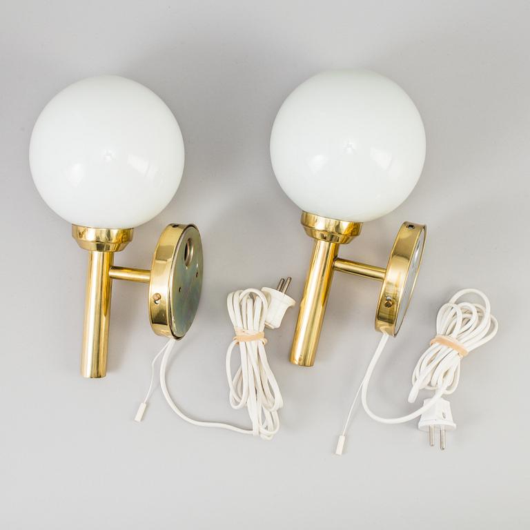 A pair of 20th century brass wall lights by Abo Denmark.