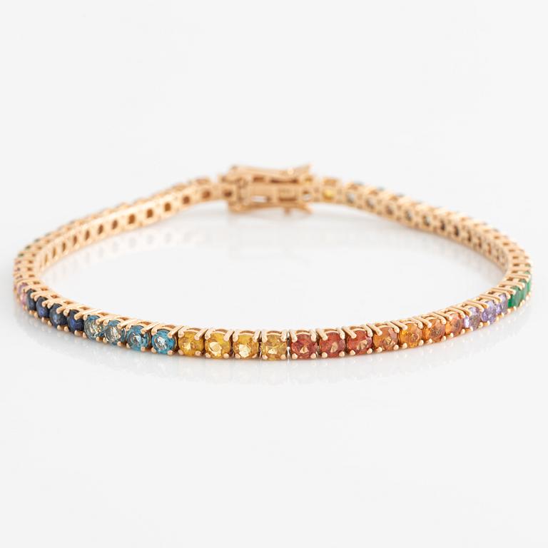 Bracelet 18K gold with faceted emeralds and sapphires in various colors.