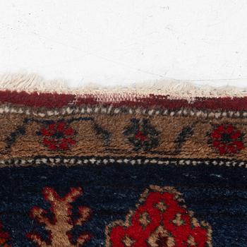 An Oriental rug, c. 282 x 154 cm.