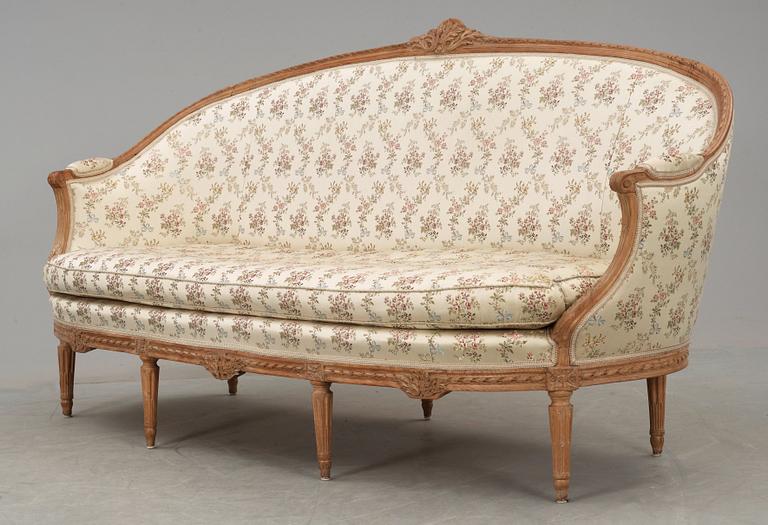 A Louis XVI 18th century sofa. Two later armchairs included.