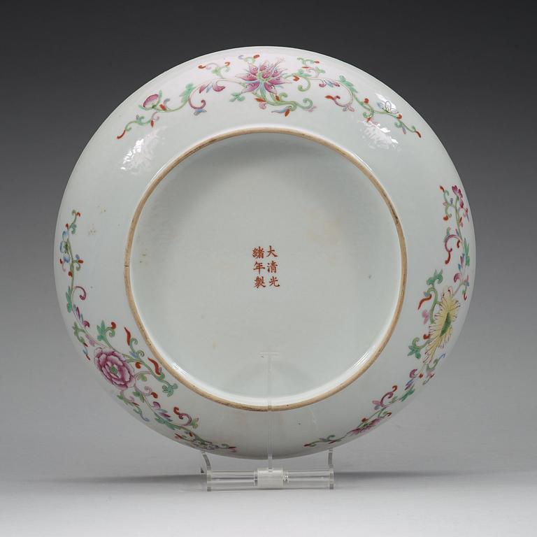 A phoenix and dragon famille rose dish, Qing dynasty, with Guangxu six character mark and period (1875-1908).