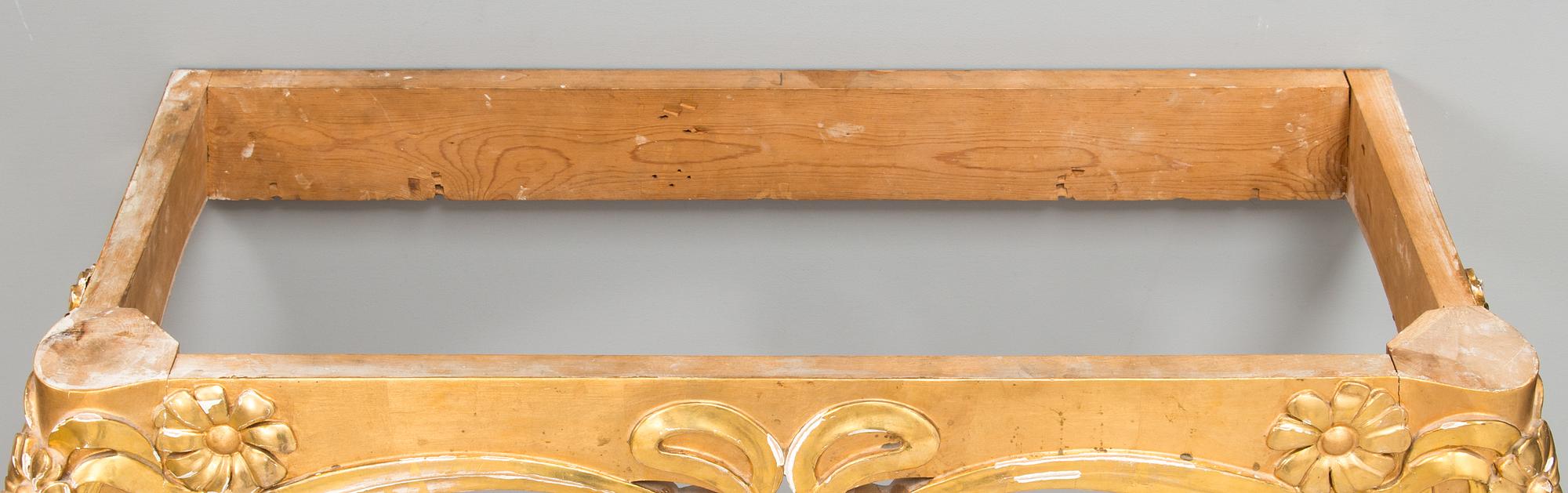 An Art Nouveau mirror with console table from early 20th century.