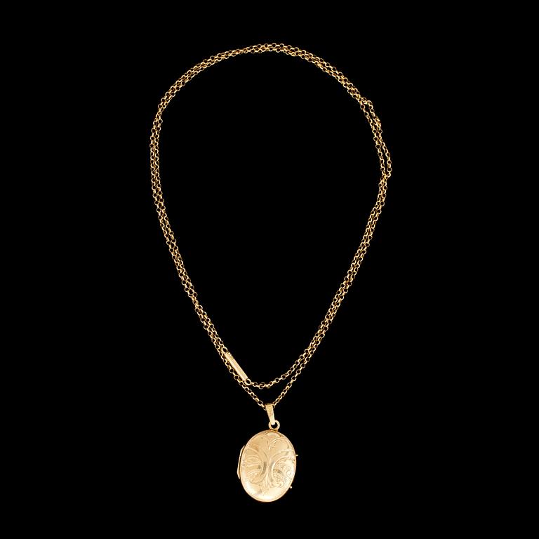 MEDALJONG med KEDJA 18 k guld. Vikt tot 12,8 g.