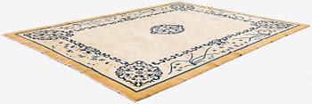 An antique Chinese carpet, 404 x 304 cm.