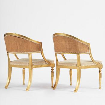 A pair of late Gustavian giltwood open-back armchairs, Stockholm, late 18th century.