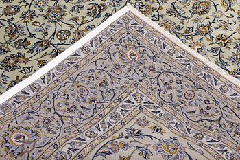 A Keshan carpet, signed, 397 x 302 cm.