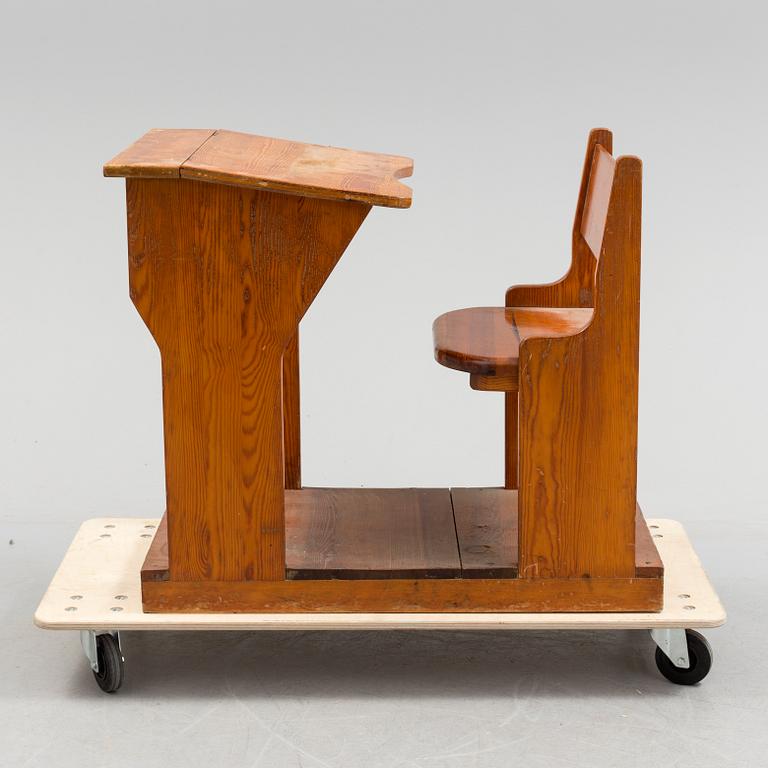 A first half of the 20th century school bench.