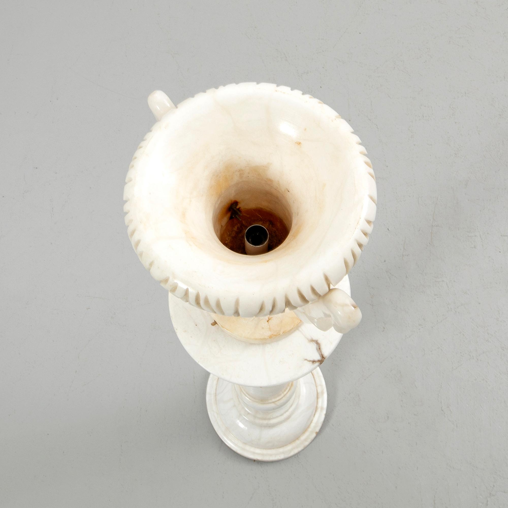 Pedestal with urn, 20th century.