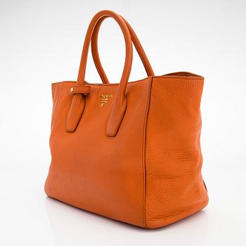 Prada, A 'Vitello Daino Tote' bag.