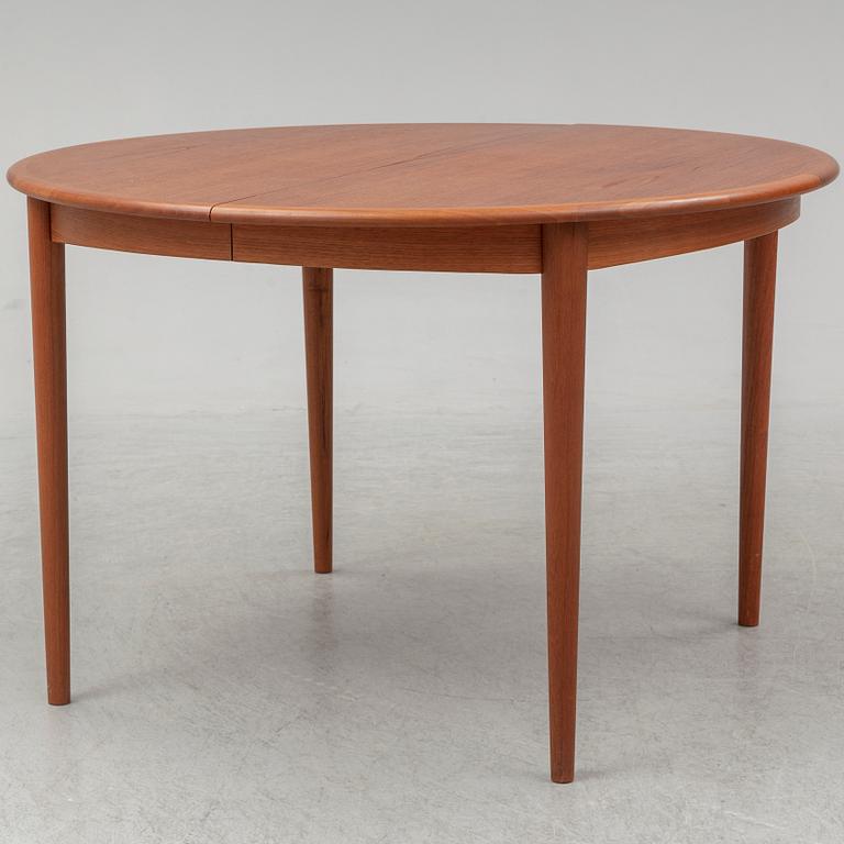 A 1960s teak veneered dining table.