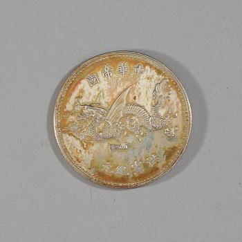 A box with five silver coins, Republic, early 20th Century.