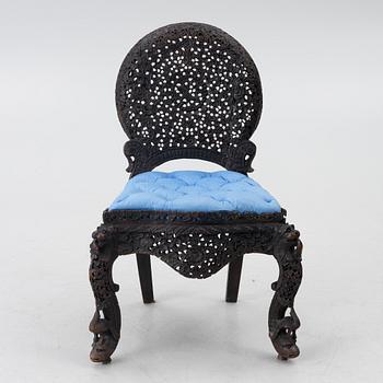 A carved 'blackwood' armchair.  bombay presidency circa 1880.