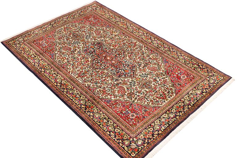 A Ghom rug, c. 202 x 137 cm.