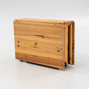 A pine gateleg table, 19th Century.